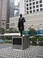 Statue of Sir Thomas Jackson, 1st Baronet, with Prince's Building in the background, in March 2006.