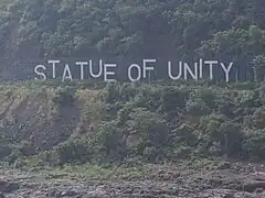 Statue of Unity sign board across the river