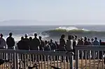 A crowd watches the waves at Steamer Lane