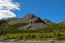 Mountain informally named Stegosaurus Ridge for its resemblance to the dinosaur, above the Firth River, in Canada's Ivvavik National Park.