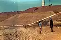 A view of the dam wall of Sterkfontein Dam during construction. In the foreground is resident Engineer David Bell.