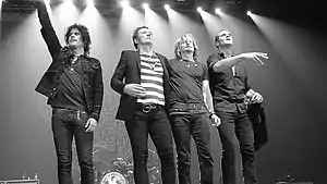 Stone Temple Pilots' original lineup in Manila, Philippines, on March 9, 2011. From left to right: Dean DeLeo, Scott Weiland, Eric Kretz, and Robert DeLeo.