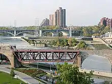 In 1963 two of the arches were replaced with a moveable truss so barges could pass through the new lock.