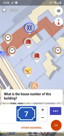 A map with different colored icons on it, currently a quest about a house number