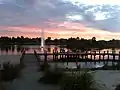 Sunset at Waterways Lake, viewed from the main pier on the north shore near Waterways Boulevard