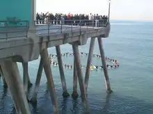 A surfer memorial service being held at the Huntington Beach Pier