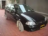 A 2008 Suzuki Cultus in a garage