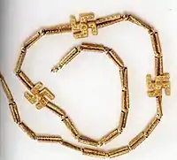 A swastika necklace excavated from Marlik, Gilan province, northern Iran, circa 1,200 – 1,050 BCE