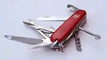 Folding pocket knife with multiple exposed tools