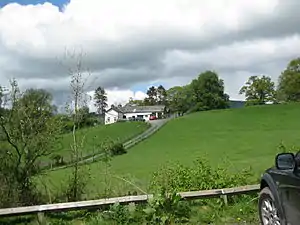 Sycharth, Motte and Bailey Castle and adjacent farmhouse