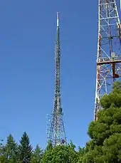 Transmission towers. Note that the upper parts of the tower in the background are guyed.