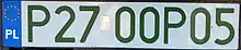 A single-row registration plate reading P27-00P05 in green-tinted letters.