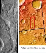 Tader Valles, as seen by THEMIS.  Smooth material in channels may be a mantle in the form of dirty snow.  Tader Valles is in the Phaethontis quadrangle.