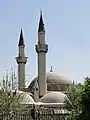 The minarets of the mosque seen from outside the fence