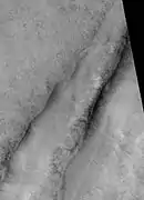 Tantalus Fossae, as seen by HiRISE.  Click on image to see dust devil tracks.  Image is located in Arcadia quadrangle