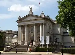 Large building with porticoed entranceway and central dome