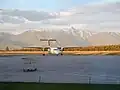 An Air Canada Express Dash 8-Q300 taxiing up to the terminal