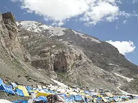 Tents are available to hire for a small fee near the base of the imposing Amarnath Cave as visible in the background.