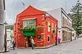 Conspicuous corner tavern with balcony