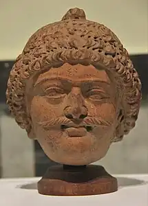 Terracotta head from Akhnoor (Jammu). Head presented to the museum from the collection of Alma Latifi. (6th century CE)