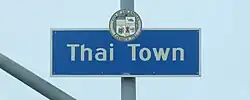 Thai Town neighborhood sign located at the intersection of Normandie Avenue and Hollywood Boulevard.