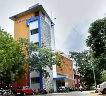 a college complex with a building in the background