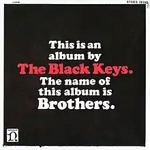 The words "This is an album by the Black Keys. The name of this album is Brothers," in block letter on a black background. "The Black Keys" is in red while the rest is in white.