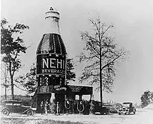 A 64-foot-tall (20 m) Nehi Bottle located near Auburn, Alabama, in an area referred to as "The Bottle" (destroyed by fire in 1933)