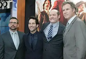 Four young men in suits