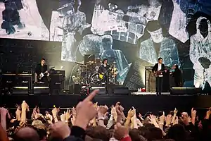 The Libertines performing in 2014 From left: Pete Doherty, Gary Powell (on drums), Carl Barât, John Hassell