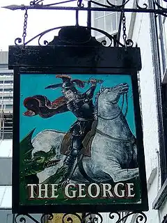 The sign depicts Saint George slaying a dragon.