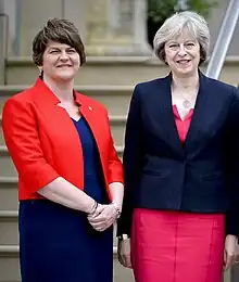 Colour photograph of Arlene Foster and Theresa May standing together outside Stormont Castle in June 2016