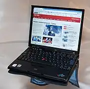 A photograph showing an open Lenovo ThinkPad X60s