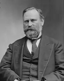 Black-and-white photograph of a bearded man