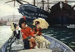 soldier in scottish uniform with a young woman on each side in a small boat