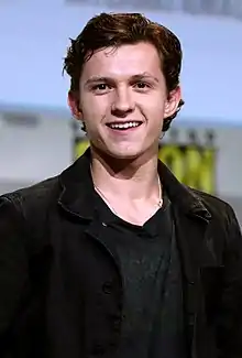 A picture of Tom Holland smiling towards the camera