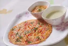 Uttapam is one of the many varieties of dosa prepared in India and served for breakfast.