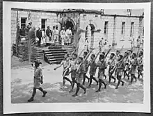 Members of the Tonga Defence Force of 2nd NZEF on parade in Tonga celebrating the capitulation of Italy in 1945