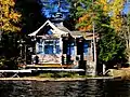 A newer building between the two boathouses.