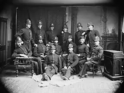 Members of the Toronto Police Force wearing custodian helmets in 1883.