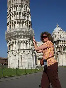 Tourist in a common pose at Tower of Pisa, June 2009