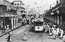 Tram on a busy city street