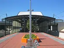 Red brick island platform with metal shelter