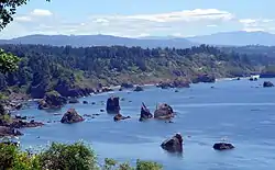 A 2007 view of the coastline south of Trinidad overlooking Trinidad Bay with offshore rocks; part of the California Coastal National Monument.