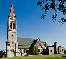 Romanesque church with an orange spire