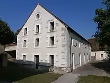 view of gable of a building with three floors of windows