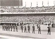 Photograph of the Tunisian delegation parading in the stadium