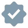 Gray eight-lobed badge with checkmark icon