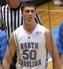 Tyler Hansbrough is wearing a North Carolina jersey on the court