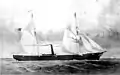 a two-masted schooner steaming with full sails